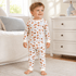 Toddler wearing Magnolia Baby Hot Bagels two piece pajama set with all over bagel and lox print in Peruvian Pima cotton
